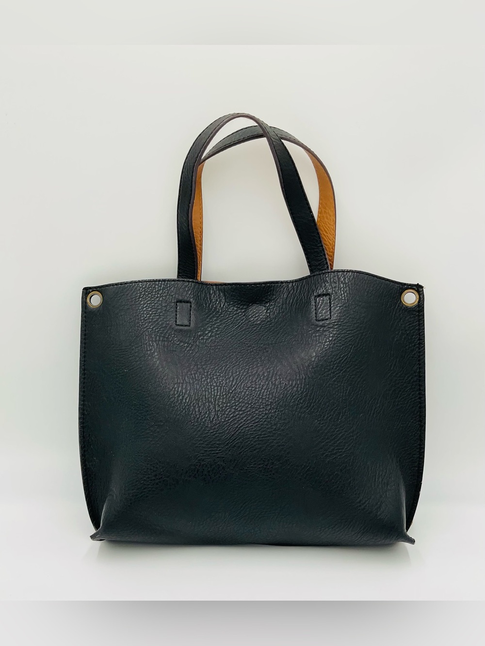 Classic Minimalist Black Faux Leather Tote Bag with Caramel-Colored Interior